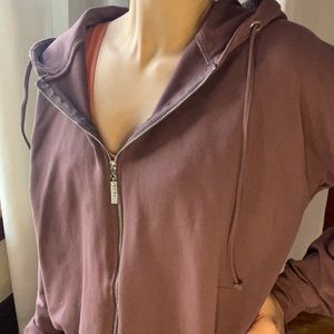 Meshki zip up hoodie. Adjustable drawstrings. Size small, fits oversized.